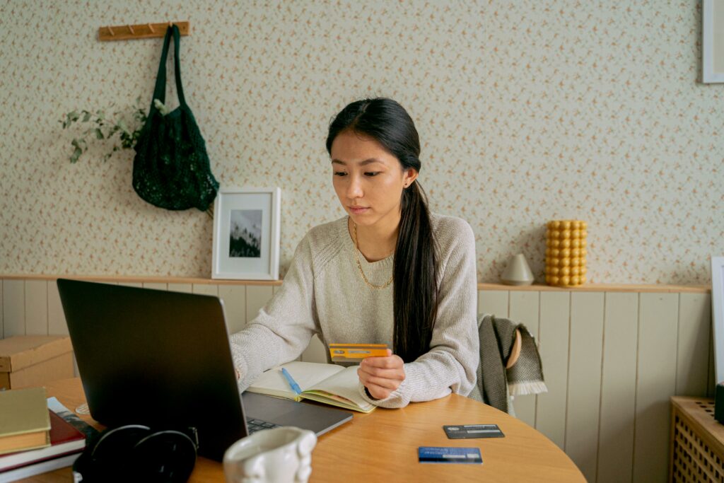 a lady making payment with credit card on the internet