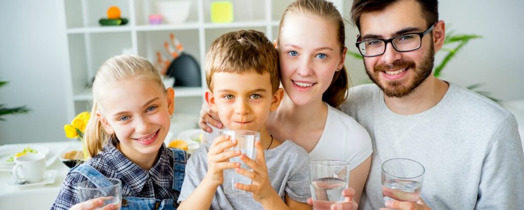 a family drinking water