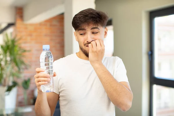 a man who is about to drink water