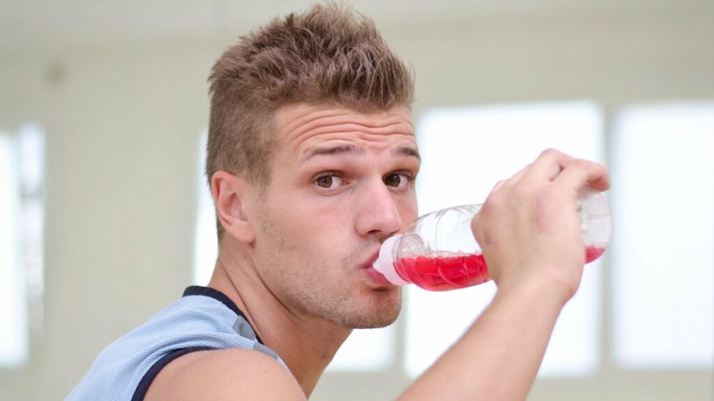 a man drinking sport drink