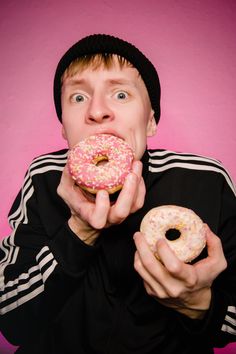 a man eating a donut