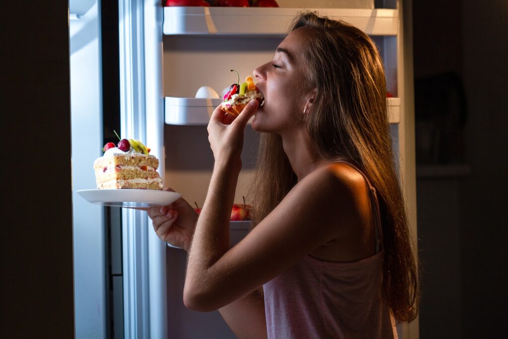 a lady eating cake