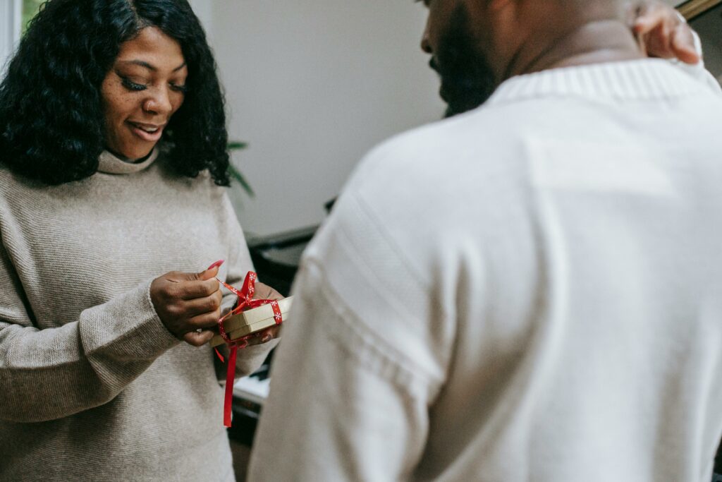 a man surprising his wife with a gift