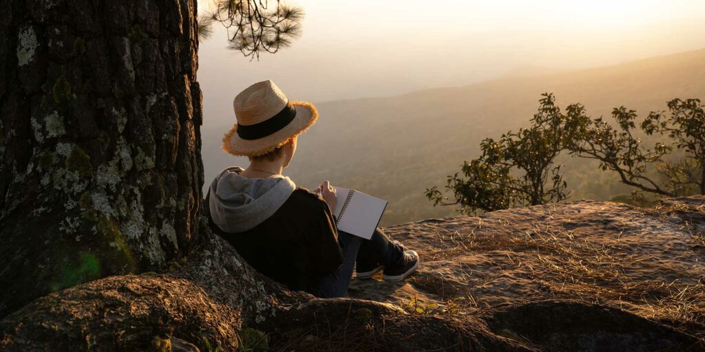 a man meditating under a trew