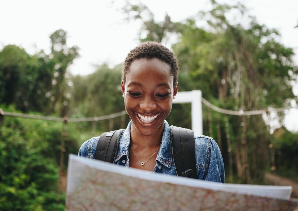 A happy lady reading while traveling