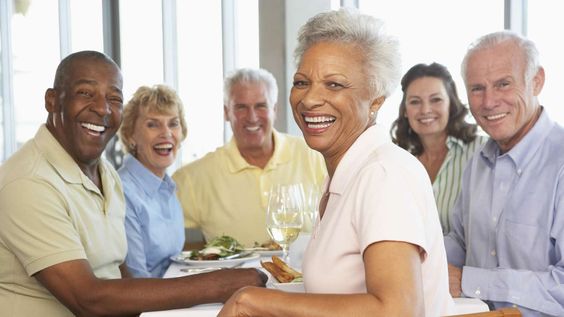 picture of 4 old and happy people drinking water from a glass cup