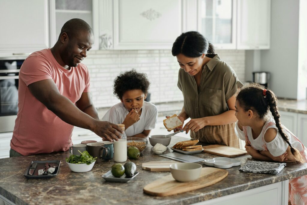 A family of four preparing to eat