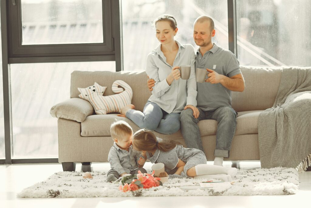 a wife and husband holding a cup of coffee