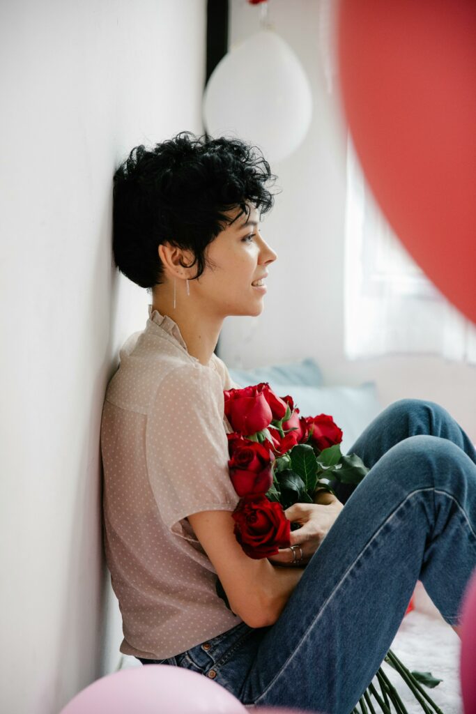 a lady holding flower due to self love