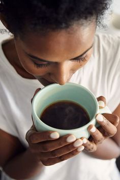 a woman drinking coffee