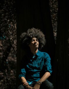 Photo of Man Wearing Blue Top While Looking Away