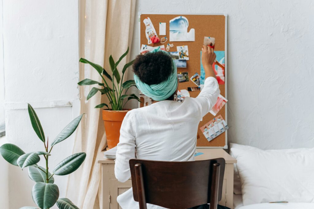 Woman in White Long Sleeve Shirt Sitting on Chair